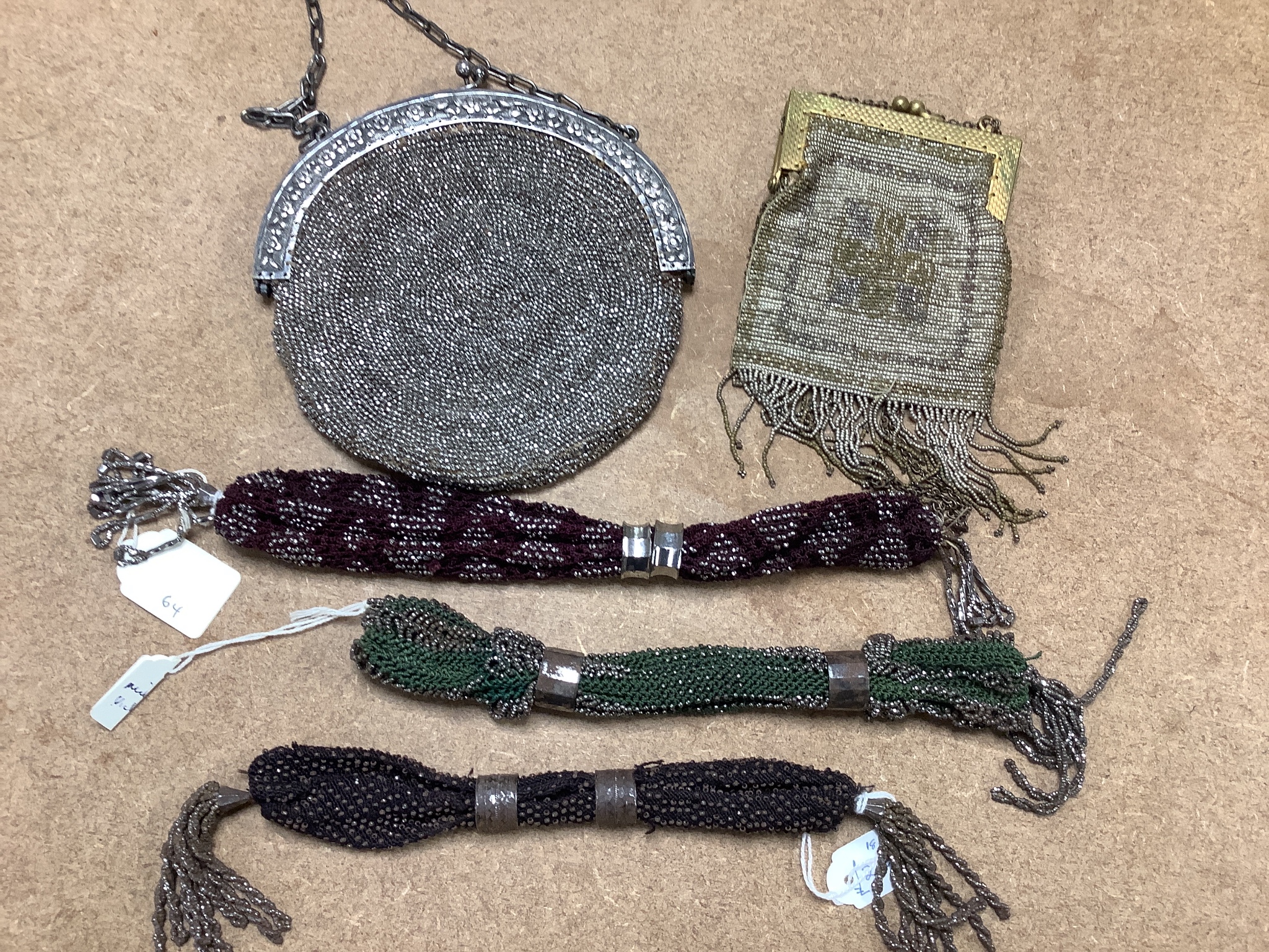 A collection of approximately fifty Victorian and later beadwork, white metal and fabric purses etc.